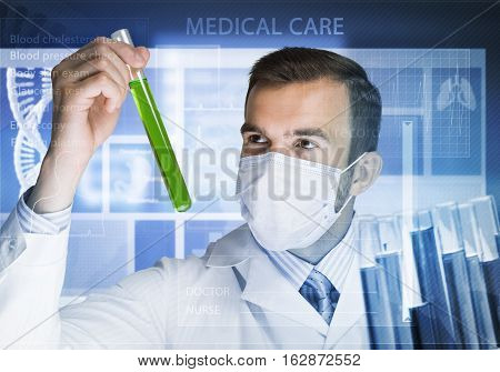 Young scientist mixing reagents in glass flask in clinical laboratory