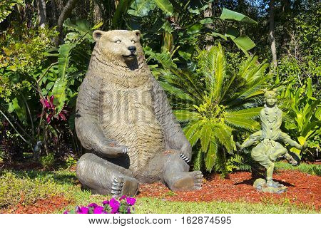 Gotha Florida - December 22nd 2016: Brown Bear sitting in garden at Christmas time Gotha Florida - December 22nd 2016
