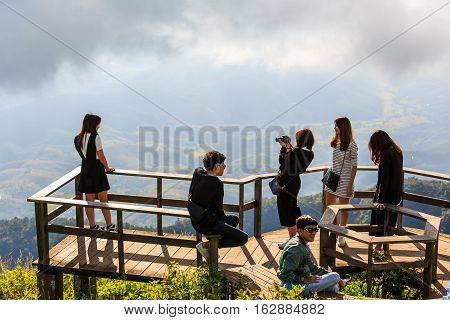 CHIANG MAI THAILAND - 06 NOVEMBER 2016 - Unidentified tourists enjoy taking their portrait photograph with nature background at Kew Mae Pan panoramic vantage point.