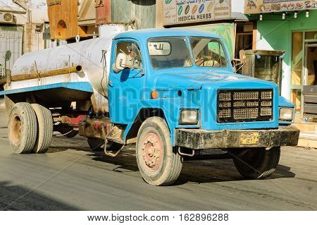 Hurghada, Egypt - November 6, 2006: Sewerage truck on street moving to clean up sewerage overflows, cleaning pipelines and potential pollution issues