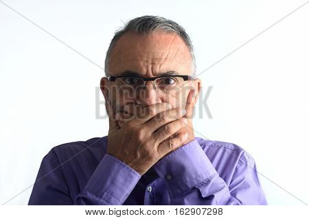 middle aged man with hand in mouth