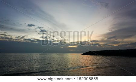 Beautiful sunset scenery at seascape with long jetty and wave view. Soft focus due to long exposure shot. Composition of nature.