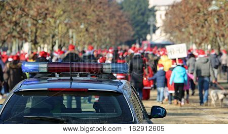 Police Car Escorting The Protesters