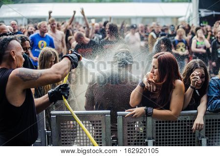 TOLMIN, SLOVENIA - JULY 24TH: HEAVY METAL FAN ENJOYING BATH AFTER MUDD FIGHT THE METALDAYS FESTIVAL ON JULY 24TH, 2016 IN TOLMIN, SLOVENIA