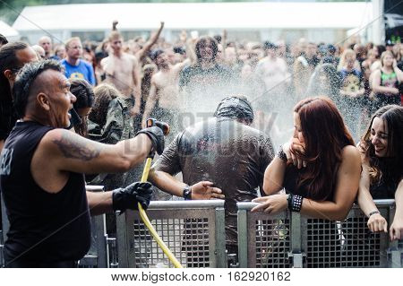 TOLMIN, SLOVENIA - JULY 24TH: HEAVY METAL FAN ENJOYING BATH AFTER MUDD FIGHT THE METALDAYS FESTIVAL ON JULY 24TH, 2016 IN TOLMIN, SLOVENIA