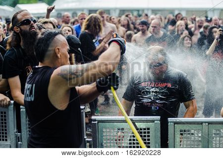 TOLMIN, SLOVENIA - JULY 24TH: HEAVY METAL FAN ENJOYING BATH AFTER MUDD FIGHT THE METALDAYS FESTIVAL ON JULY 24TH, 2016 IN TOLMIN, SLOVENIA