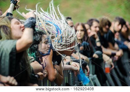 TOLMIN, SLOVENIA - JULY 24TH: HEAVY METAL FANS WITH DREADLOCKS HEADBANGING AT THE METALDAYS FESTIVAL ON JULY 24TH, 2016 IN TOLMIN, SLOVENIA
