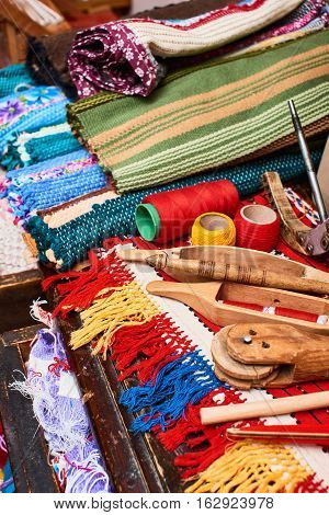 The set of working tools for weaving lying on textiles handmade