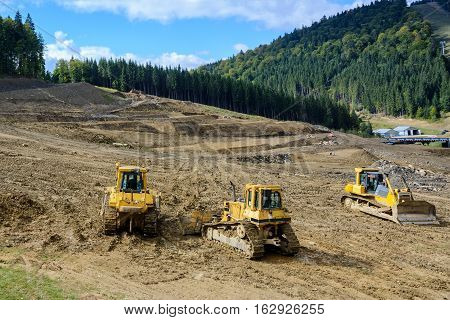 Construction machinery. Excavation work at the construction site.