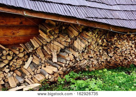 Firewood. Store firewood. Wood burned as fuel.