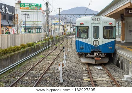 TOKYO, JAPAN - 20 NOV 2016 : Train stopped at Fujikyu Railway station.The railway system is one of the most important public transportation in Japan.