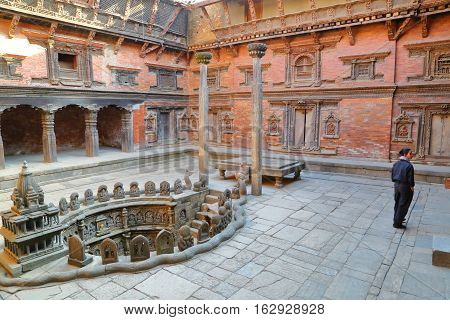 PATAN, NEPAL - DECEMBER 21, 2014: Courtyard of Mul Chowk Royal Palace with a Royal Stepwell, Durbar Square
