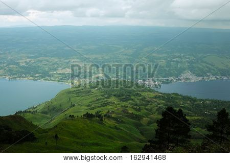 Panorama of Samosir Island and Lake Toba. Aerial view from Pusubukit Volcano. North Sumatra, Indonesia.