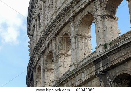 Coloseum details on a blue sky Rome Italy