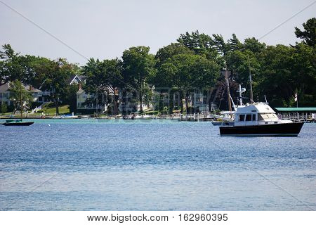 A boat is anchored off the shore of Harbor Point, Michigan during August.