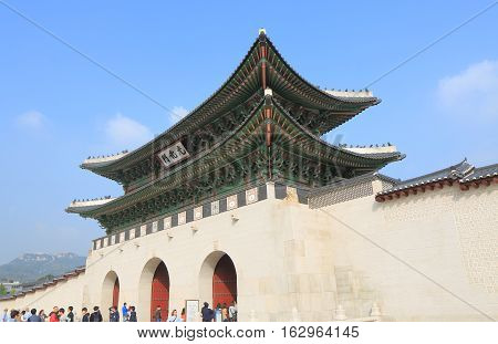 SEOUL SOUTH KOREA - OCTOBER 19, 2016: Unidentified people visit Gwanghwamun Gate in Seoul. Gwanghwamun Gate is the main and largest gate of Gyeongbokgung Palace