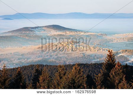 Kreuzberg The picturesque village in Bavaria with a Church of St. Anne on top of a hill. Germany. Aerial view from tower Haidel.