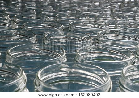 huge stack of empty transparent glass  jars