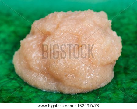 Handful Of Caviar Of Cod Fish On Green Plate