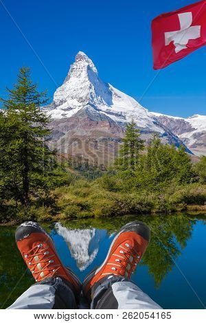 Matterhorn Peak With Hiking Boots In Swiss Alps.