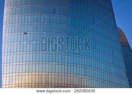Modern Office Building Detail, Glass Surface Clouds Reflected In Windows Of Modern Office Building. 