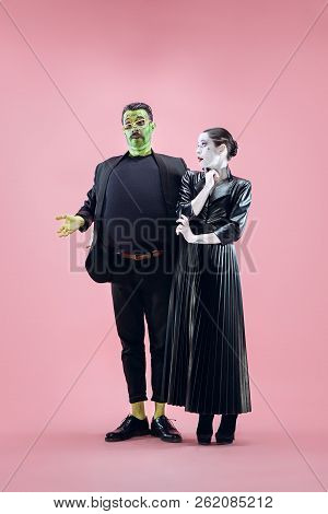 Halloween Family. Happy Couple In Halloween Costume And Makeup. Bloody Theme: The Crazy Maniak Faces