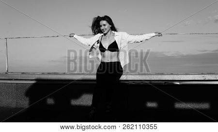 Young Sexy Woman Posing In The Roof, Wearing Leater Jacket, Swag Floral Hat Mirrored Sunglasses And 