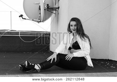 Young Sexy Woman Posing In The Roof, Wearing Leater Jacket, Swag Floral Hat Mirrored Sunglasses And 