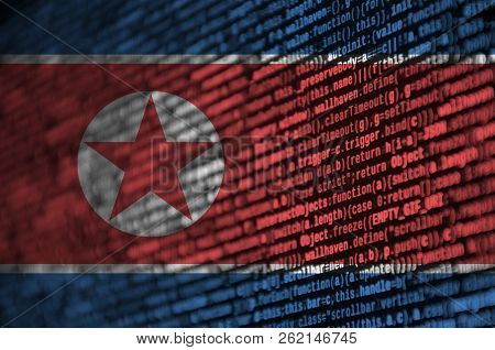 North Korea Flag  Is Depicted On The Screen With The Program Code. The Concept Of Modern Technology 
