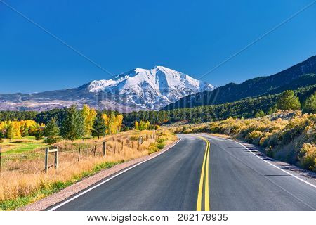 Highway in Colorado at autumn, USA. Mount Sopris landscape.