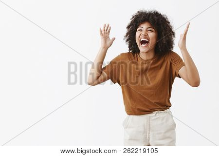 Studio Shot Of Over-emotive Carefree And Happy Stylish Modern African American Female In Trendy Brow
