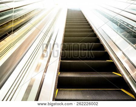 Escalator In Shopping Mall. Moving Up And Down Staircase. Electric Escalator.