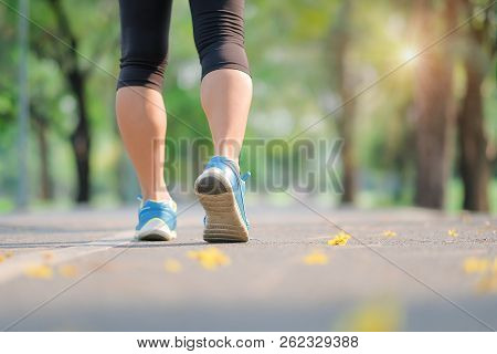 Young Fitness Woman Legs Walking In The Park Outdoor, Female Runner Running On The Road Outside, Asi