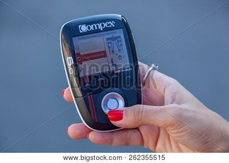 Kiev Ukraine December 17, 2017: Compex Electrostimulator For Fitness. Install Electrostimulator On T