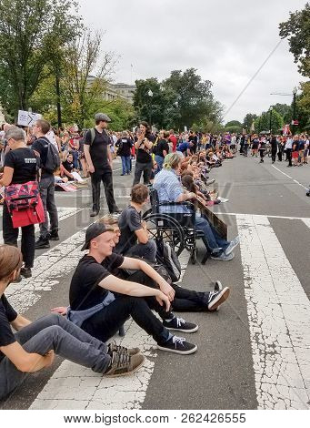 Washington, Dc  - October 06, 2018: People Hold Signs And Rally At The Supreme Court To Protest The 