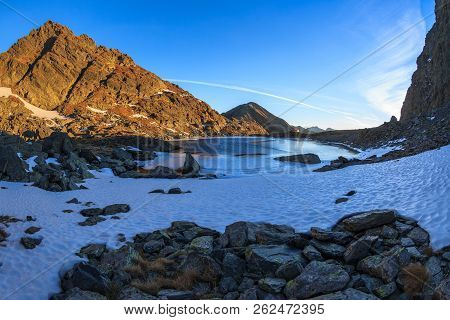 Sunrise In Caltun Lake. Fagaras Mountains Romania
