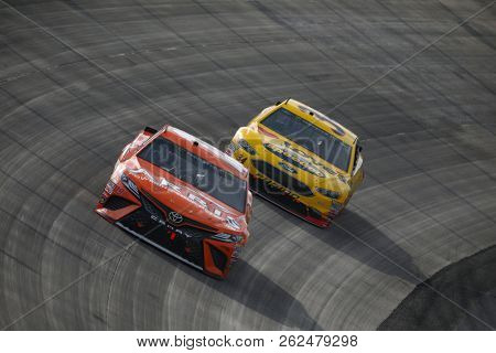 October 07, 2018 - Dover, Delaware, USA: Daniel Suarez (19) battles for position during the Gander Outdoors 400 at Dover International Speedway in Dover, Delaware.
