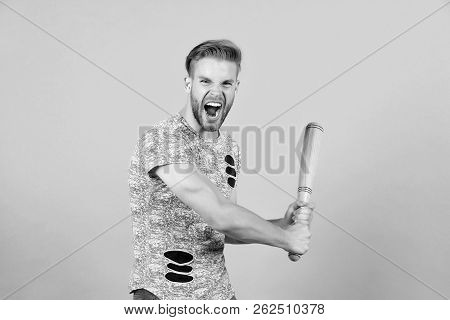Bully Man Shouting Aggressive Face, Grey Background. Man With Wooden Bat Ready To Attack. Aggressive