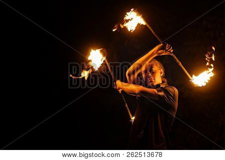 Fire Show. Fakir Dances With Two Staff. Night Performance. Dramatic Portrait