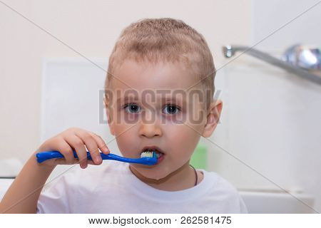 Little Boy Brushing His Teeth. Health And Hygiene.