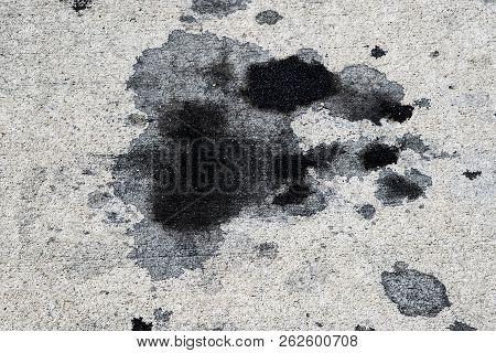 Motor Oil Stains On Concrete Pavement/texture Background
