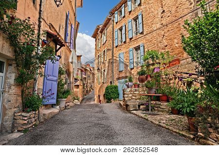 Mane, Forcalquier, Provence, France: Picturesque Ancient Alley In The Old Town With Plants And Flowe