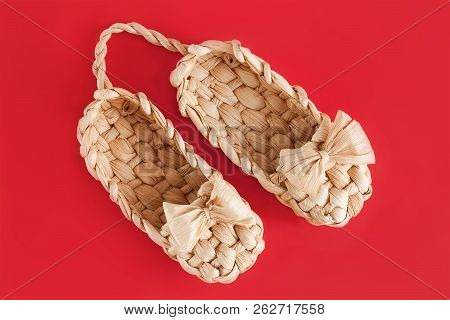 Russia Lapty Is Rural Shoes On The Red Background