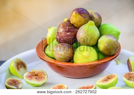 Fresh Figs By Italy, In The Glay Bowl On The White Plate Horizontal