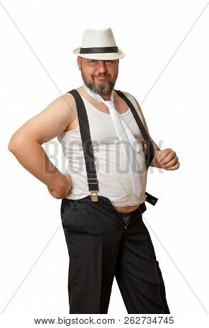 A Man In A Hat And Shirt With A Beer Belly Is Smiling Charmingly And Looking At The Camera.