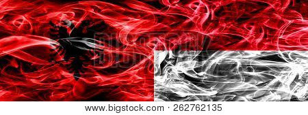 Albania Vs Monaco, Monacan Smoke Flags Placed Side By Side. Thick Colored Silky Smoke Flags Of Alban