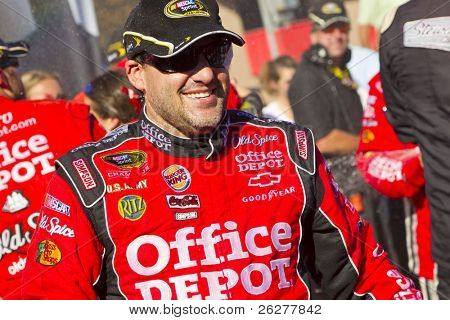 FONTANA, CA - OCT 10:  Tony Stewart holds off the rest of the Sprint Cup teams to win the Pepsi Max 400 race at the Auto Club Speedway in Fontana, CA on Oct 10, 2010.