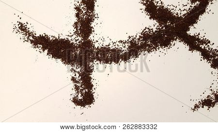 Ground Coffee on White Background.  Coffee Grinds Laid Out Artistically on White Background.