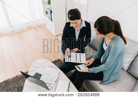 Housewife And Insurance Advisor Counting Payment
