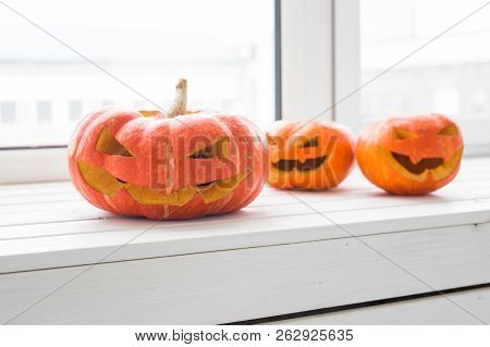 Halloween Pumpkins. Funny Jack Olantern On The Light Room